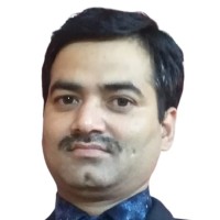 Portrait of PC Joshi, Founder and CEO of Divyansh Enterprises, smiling and wearing formal attire